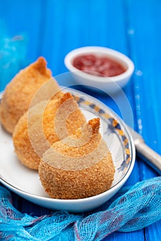 Brazilian snack coxinha de frango on dish