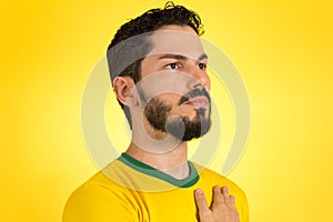 Brazilian soccer football player listening to the anthem and han