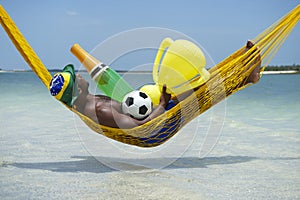 Brazilian Soccer Player Celebrates with Champagne and Trophy