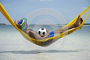 Brazilian Soccer Player Relaxing in Beach Hammock