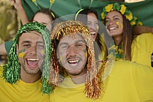 Brazilian sport soccer fans celebrating victory together.