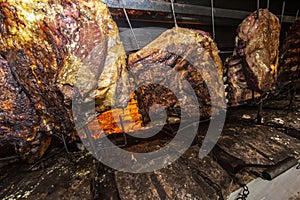 Brazilian style beef ribs Barbecue grill on skewers  at a churrascaria steakhouse photo
