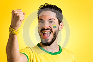 Brazilian supporter of National football team is celebrating, ch