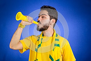 Brazilian supporter of National football team is celebrating, ch
