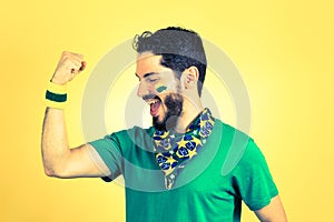 Brazilian supporter of National football team is celebrating, ch