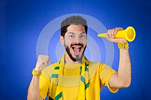 Brazilian supporter of National football team is celebrating, ch