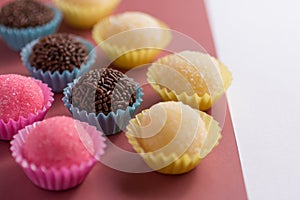 Brigadeiro, Beijinho and Bicho de Pe: sweets from Brazil. Child photo