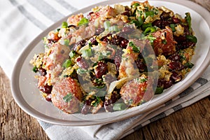 Brazilian traditional tropeiro fried beans with greens, sausages photo