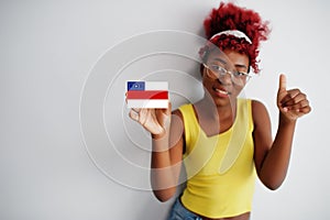 Brazilian woman with afro hair hold Amazonas flag  on white background, show thumb up. States of Brazil concept photo