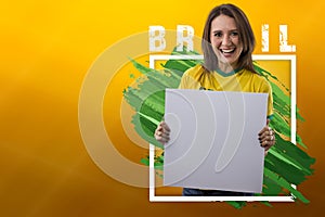 Brazilian woman fan, celebrating on a yellow background