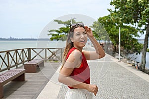 Brazilian woman turns around walking on Vitoria promenade, Espirito Santo, Brazil photo