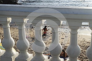Brazilians and tourists bathe at Porto da Barra beach photo