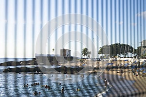 Brazilians and tourists bathe at Porto da Barra beach photo