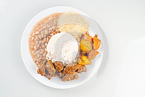 Brazillian Deli Food plate with rice, beans, vegetables and beef