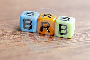 BRB text represent Be Right Back on wooden. Taking a break concept