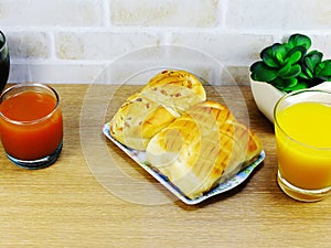 Bread with bacon ham pork mayonnaise and fruit juice