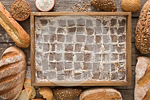 Bread bakery background. Brown and white wheat grain loaves, che