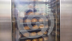 Bread in bakery oven turning in the hot air