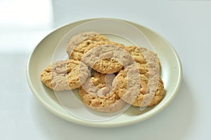 Bread Biscuits with Cashew Nuts on dish on white background