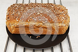 Bread on the black plate and the steel trivet