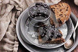 Bread with blueberry jam on the plate