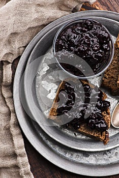 Bread with blueberry jam on the plate