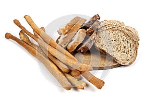 Bread and breadsticks isolated on white background