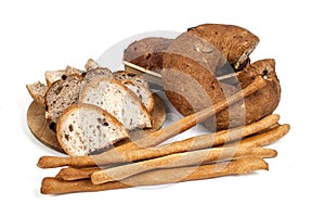 Bread and breadsticks isolated on white background