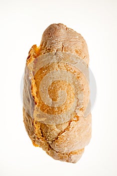 Bread buns top view on white background. Close-up of a single whole bread roll isolated on white.