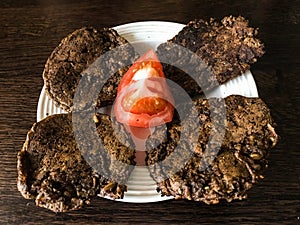 Bread cakes with tomato on a plate