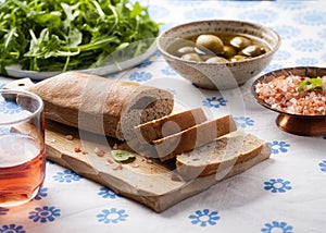 Bread with Carob powder, olives, pink salt and rucola
