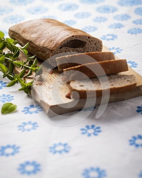 Bread with Carob powder and oregano on the side