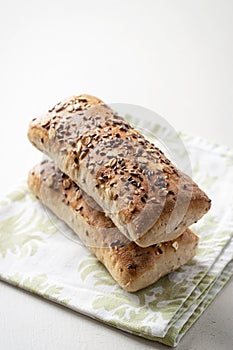 Bread with cereals and flax seeds on a clean linen