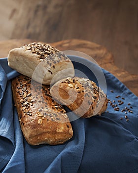 Bread with cereals and flax seeds on a linen