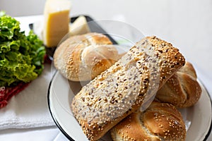 Bread with cheese, lettuce and cakes photo