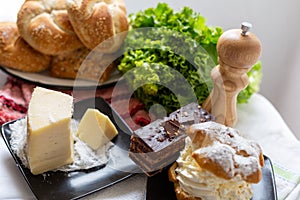 bread with cheese, lettuce and cakes photo