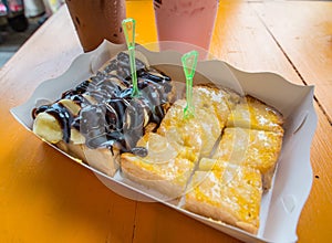 Bread with chocolate spread , milk and butter
