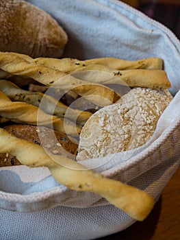 Bread and crispy breadsticks grissini in basket