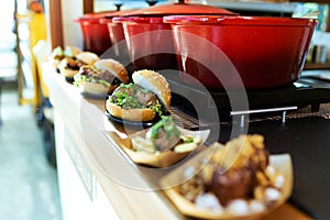 Bread with different types meatballs in a food truck.