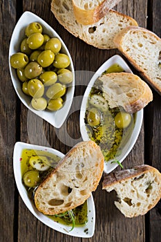 The bread dipped in olive oil with herbs and spices