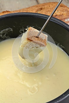 Bread dipped in a Savoyard fondue dish