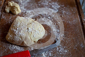 Bread dough  on floured board ,making bread rolls at home