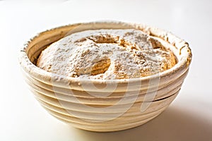 Bread dough raw in proofing basket photo