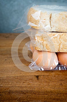 Bread and egg in plastic bag