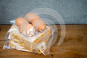 Bread and egg in plastic bag