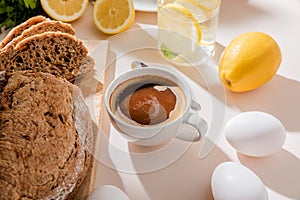 , eggs, lemon water and cup of