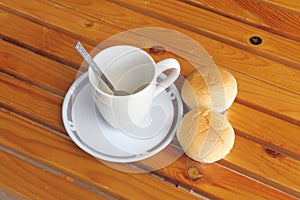 Bread with empty cup of coffee
