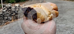 bread filled with meses on hand and ready to eat photo