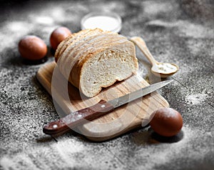 Bread, flour, eggs and cherry tomatoes.