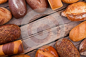 Bread frame on wooden background.